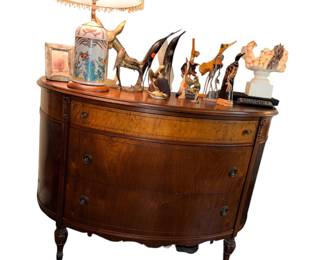 vintage demilune half-moon chest of drawers featuring a rich mahogany finish and a contrasting burl wood top drawer.