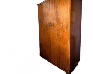 vintage burr walnut wardrobe featuring a striking book-matched grain pattern across its double doors
