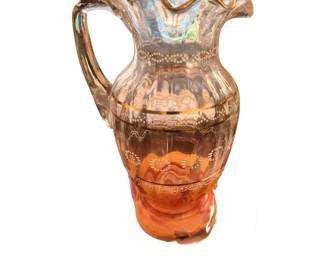 antique pressed glass pitcher featuring a peach-to-clear or amber ombre gradient with ruffled edges, an applied handle, and delicate white enamel dot or floral stenciling with gold banding.