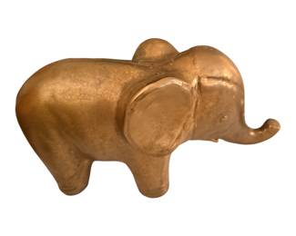 gold-toned decorative elephant figurine with large ears and an upturned trunk