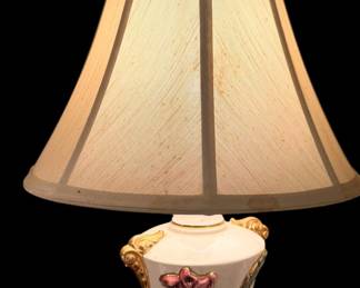 vintage porcelain urn table lamp featuring hand-painted pink floral accents and ornate gold-gilt scroll handles.