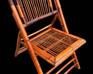 Pair This is a vintage-style burnt tortoiseshell bamboo folding chair featuring an open slat backrest and slatted seat design