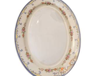 vintage porcelain oval serving platter manufactured by N.S. China (Nagoya Shokai) in Japan. It features a classic porcelain design complete with a multi-colored floral garland edge, blue scrolled accent borders, and a gilded rim 72 pieces
