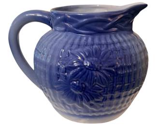 Antique blue and white stoneware poinsettia pattern pitcher
