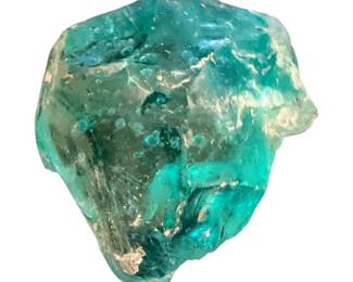 raw piece of blue-green glass, slag glass, or a rough semi-precious stone like apatite or beryl.