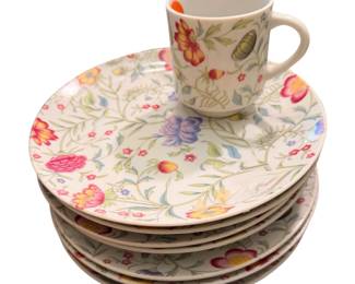 a vintage set of Avignon fine china plates and a matching cup by Toscany featuring a delicate multicolor floral pattern.