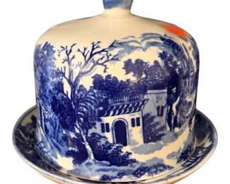 vintage or antique blue and white ceramic cheese keeper and dome featuring a classic transferware architectural landscape