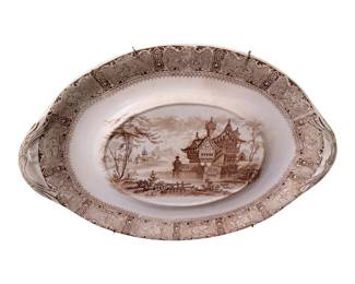 antique brown transferware vegetable dish or platter featuring the "Cairo" pattern by Copeland from the Aesthetic Movement in the late 19th century.