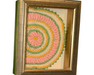  framed, vintage crocheted doily displayed in a gold shadowbox with a white mat.