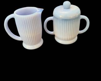 vintage milk glass sugar bowl with an opalescent or slight blue tint and vertical ribbing, featuring a matching lid and two side handles