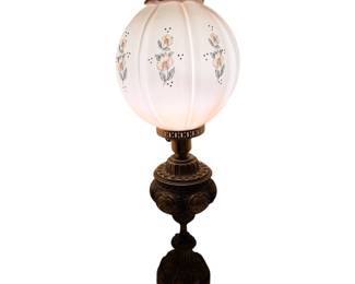 vintage milk glass hurricane lamp featuring a globular shade decorated with hand-painted pink floral motifs