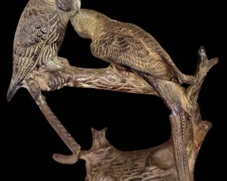 vintage brass parakeet lovebirds sculpture from mid-century India featuring two detailed birds nuzzling on a textured branch base