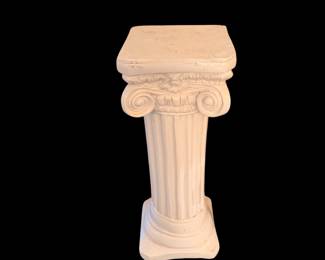 classical Ionic column pedestal featuring a fluted shaft and scrolled capital with a weathered white finish.