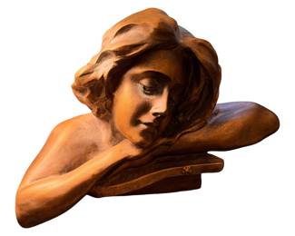 vintage bronze-toned sculptural bust of a reclining young woman resting her chin on her hand in an Art Nouveau style.