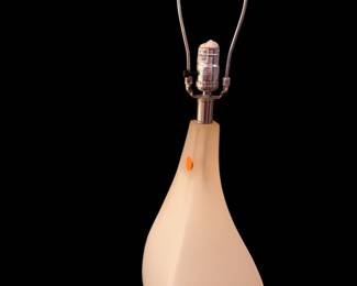 mid-century modern style table lamp with a translucent cream-colored acrylic or lucite body shaped like a teardrop or asymmetrical curve/pair