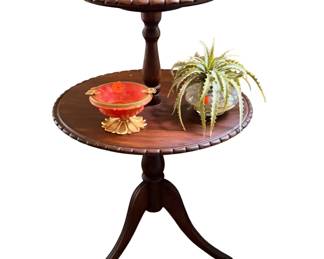 vintage two-tier mahogany dumbwaiter table featuring distinctive scalloped pie-crust edges and a classic tripod base.
