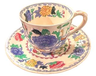 Mason's Ironstone teacup and saucer set in the Regency pattern featuring colorful hand-painted flowers and a small bird detail.
