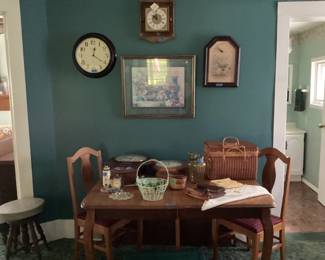 Antique oak table w/two leaves, vintage clocks, vintage table linens and vintage basket