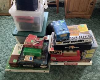 Vintage games, vintage Tyco railroad cars (still in boxes) with train track and other train related items.  Vintage race car track