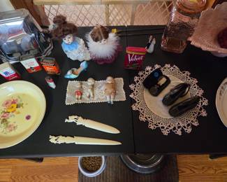 Vintage toaster. Old spice tins, antique eyeglasses with case, antique shoes, ivory letter openers, ceramic doll headsc