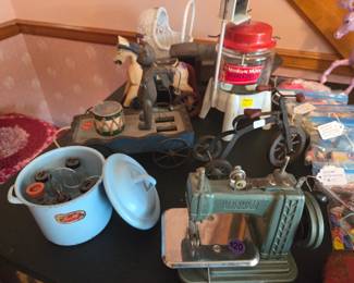 Antique bottle holder with bottles, sewing machine, clothes washer, other misc. antique