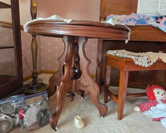 Antique possible etched wallnut table with porcelain wheels
