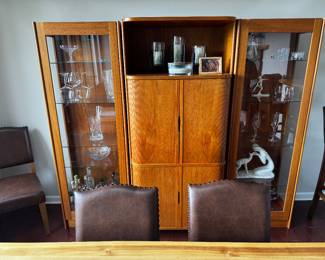 Danish/Scandinavian-style teak wall unit with a built-in bar cabinet and glass display cabinets