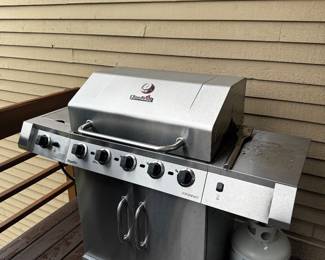 Char-Broil stainless steel grill with propane tank