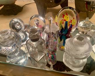 fine perfume bottles and paper weights--notice the Lalique perfume bottle to the right