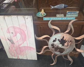 metal sun and flamingo painted boards 