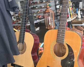 2 acoustic guitars with cases 