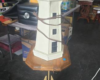 Nautical stand with lighthouse 