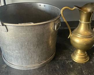 very very large stainless steel pot and a huge brass water pitcher