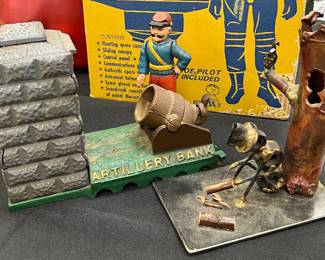 cast iron bank and a piece of brutalist art sculpture signed 