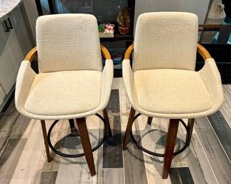 Mid-century modern style counter-height swivel barstools in cream