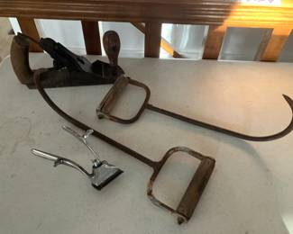 Antique hay hooks, old wood plane