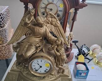 CLOCK WITH ANGLE AND CHILD FIGURES 