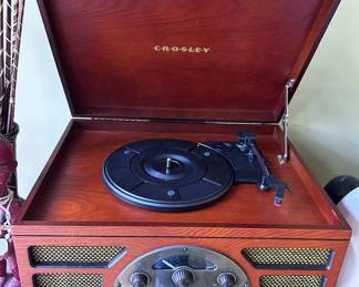 Crosley is a wood-cabinet multi-function entertainment center with turntable, CD player and radio