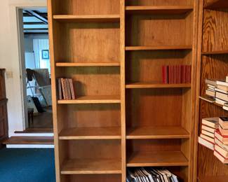 Double oak bookcase... two other wider ones available. Three matching bookcases... create a wall or use them in different rooms. Shelves are easily adjusted