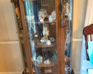 Oak curved front glass china closet. Clawfoot legs