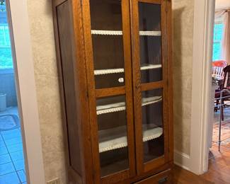 Antique oak china closet with drawer. Dishes, books collectible cars toys or whatever. Great place to store antique & vintage quilts.