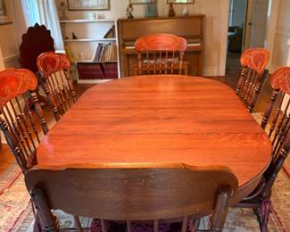 This antique oak table closed seats 4 comfortably. With ALL the leaves 8 is comfortable! Several leaves to accomodate your needs. Chairs are newer & pressed back to match the time period.any size you need.