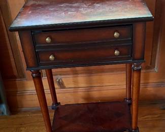 Sweet little side table. 2 drawers & 4 wheels!