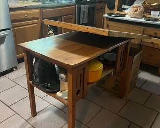 This table has a custom top that fits on top and makes the table larger