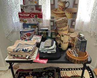 Pottery, kitchen gadgets, hand towels and rugs