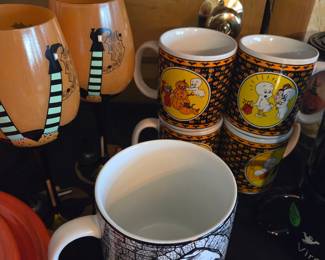 Collection of Halloween-Themed Mugs and Stemware