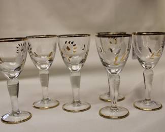 Six vintage European etched cordial glasses, with hand painted floral motifs and metallic gold rims.