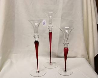 Graduating set of Block Mystique clear crystal and cranberry candlesticks originates from Europe, late 20th century.