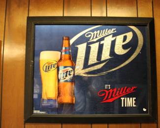 A very heavy Miller Lite sign.