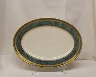 Oscar de la Renta Jade Florentine Fine Ivory China. Produced in West Germany. Green Marbleized rim detailed with gold-encrusted outer and inner bands.